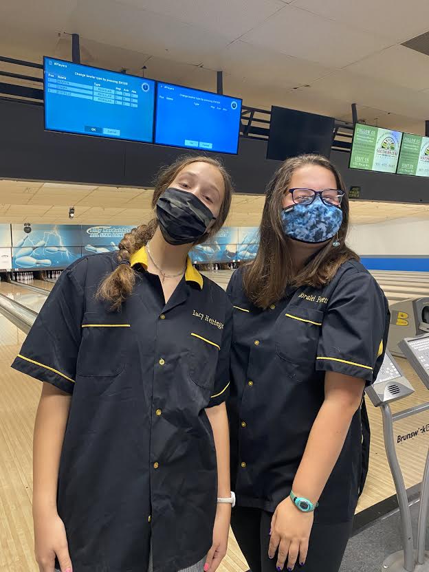 Loralei+Forgette+and+Lucy+Hettinger++in+their+bowling+uniforms+and+masks.