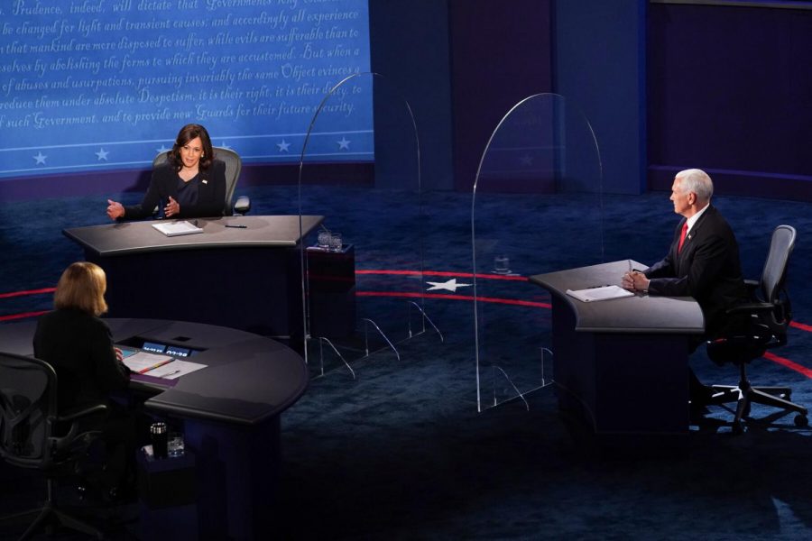 Senator+Kamala+Harris+and+Vice+President+Mike+Pence+seated+at+the+debate.