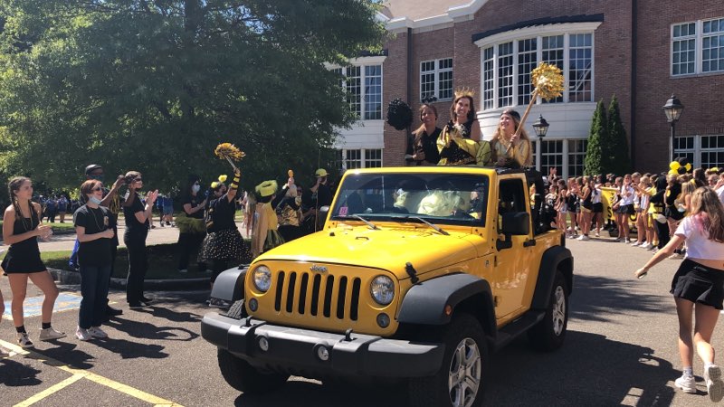 Dr. Ring and the black and gold team captains in the Black and Gold Day parade